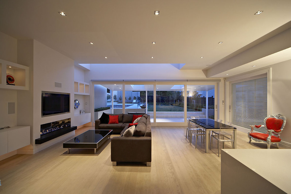 Inspiration for an expansive contemporary living room in Auckland with a ribbon fireplace and a built-in media unit.