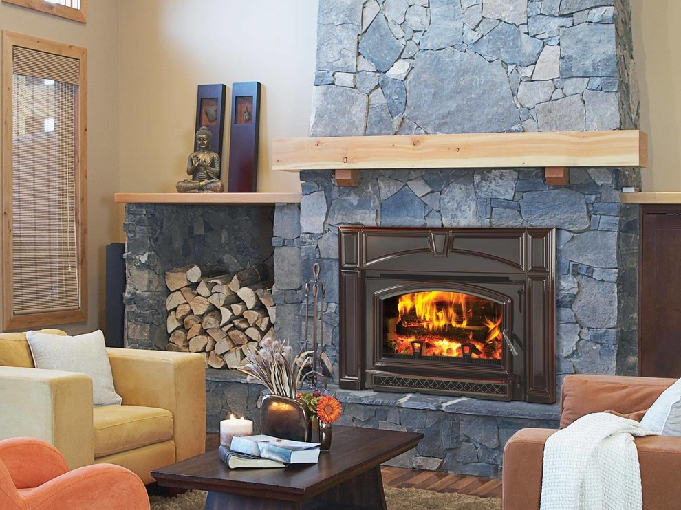 Living room - mid-sized craftsman formal and enclosed medium tone wood floor and brown floor living room idea in New York with beige walls, a standard fireplace, a stone fireplace and no tv