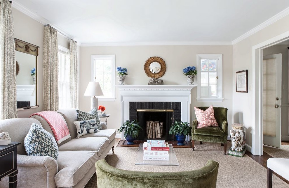 Inspiration for a medium sized classic enclosed living room in DC Metro with beige walls, a standard fireplace, a brick fireplace surround and feature lighting.