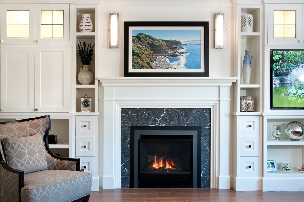 Inspiration for a large timeless formal and open concept medium tone wood floor living room remodel in Vancouver with a standard fireplace, a tile fireplace and a media wall