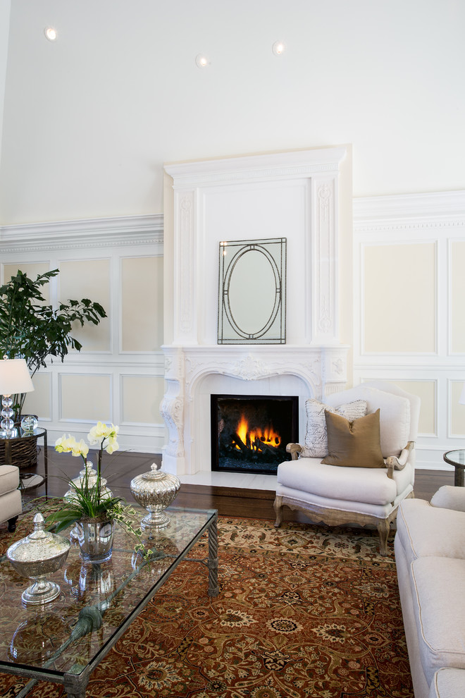 Example of a huge classic formal and open concept dark wood floor living room design in San Francisco with white walls, a standard fireplace, a stone fireplace and no tv