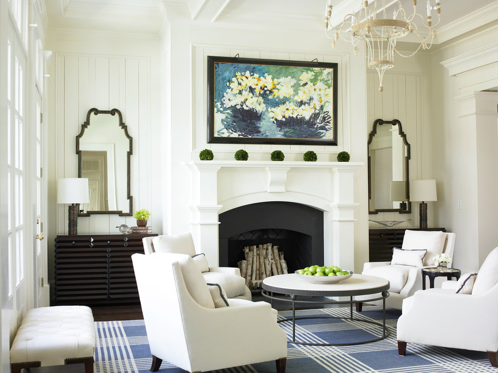 Elegant living room photo in Atlanta with white walls, a standard fireplace and no tv