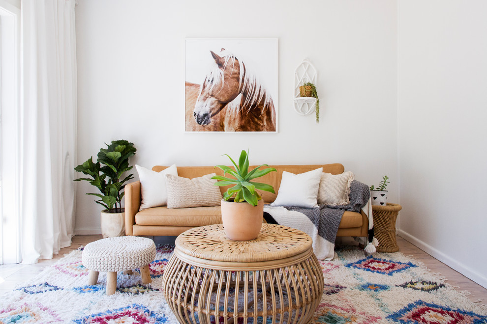 Inspiration for a coastal medium tone wood floor and brown floor living room remodel in Wollongong with white walls