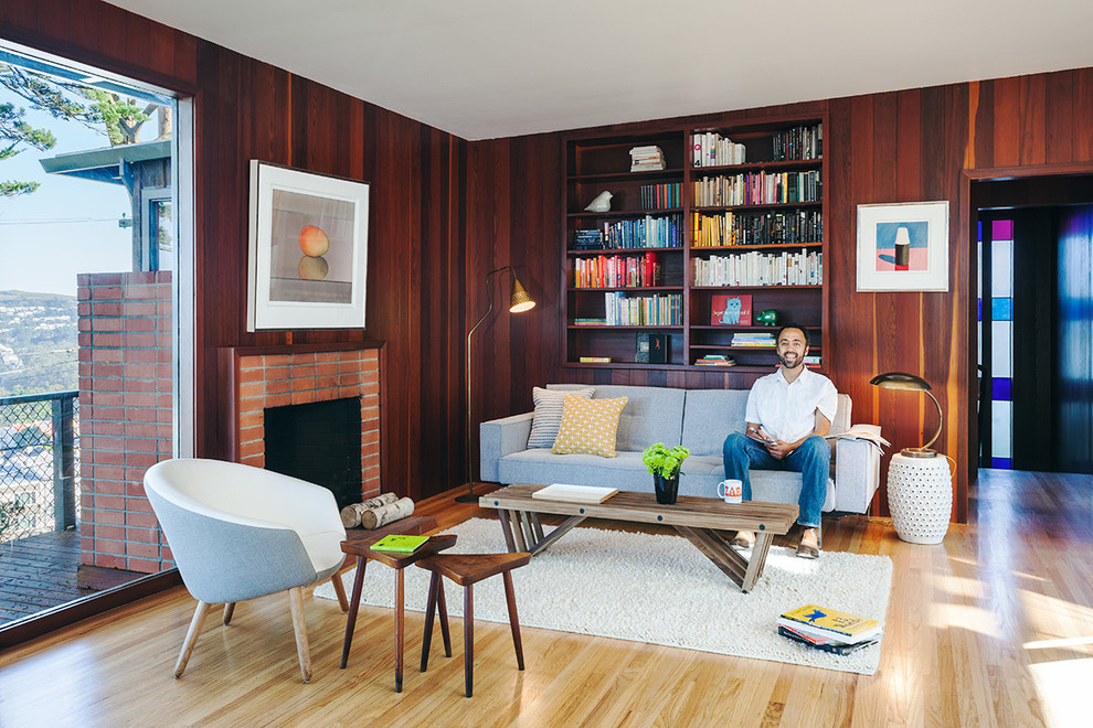 Midcentury living room in San Francisco with a brick fireplace surround.
