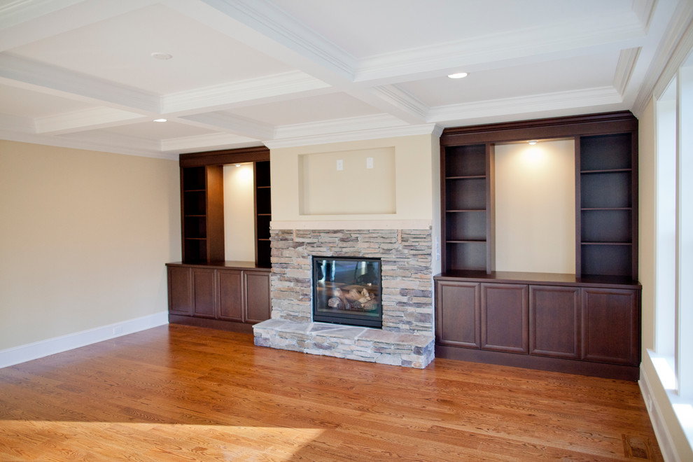 Large contemporary enclosed living room in Raleigh with a reading nook, light hardwood flooring, a standard fireplace, a stone fireplace surround and a wall mounted tv.