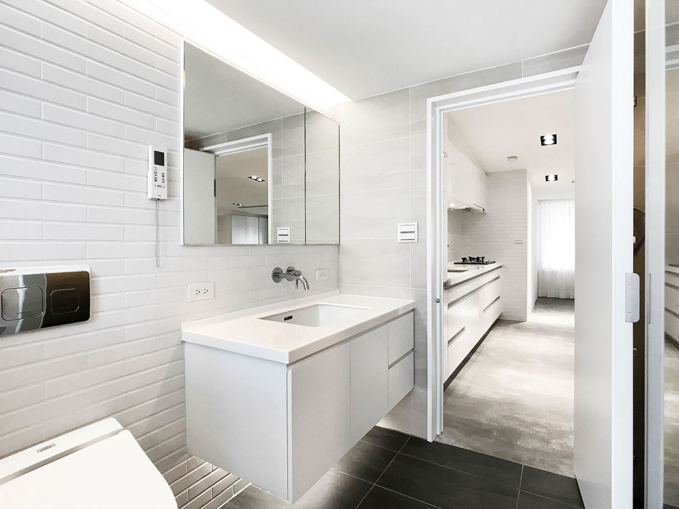 Источник вдохновения для домашнего уюта: открытая гостиная комната в стиле модернизм с белыми стенами, бетонным полом, серым полом и сводчатым потолком