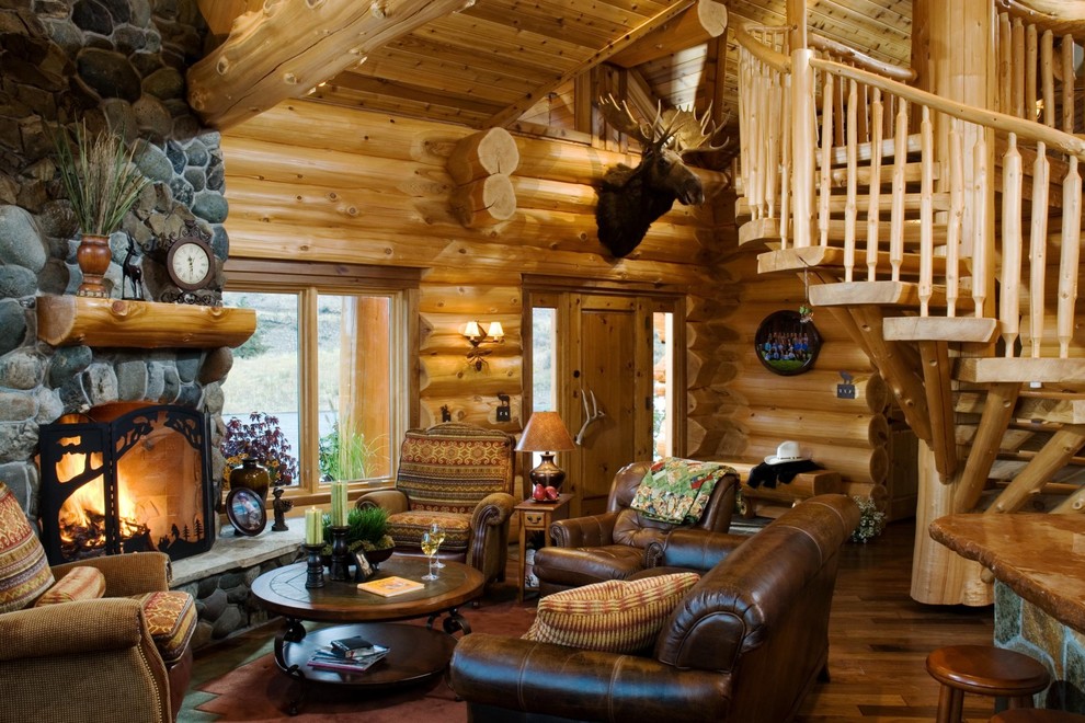 Design ideas for a rustic living room in Boise with a standard fireplace and a stone fireplace surround.