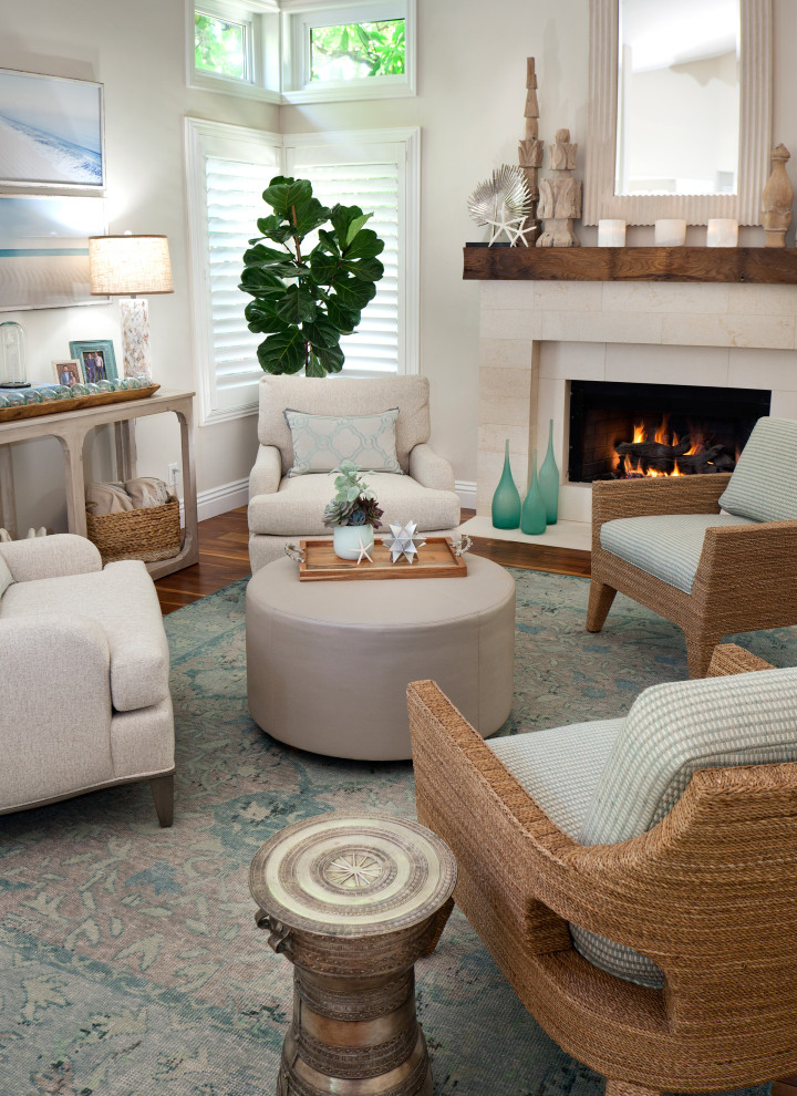 Design ideas for a small nautical open plan living room in Orange County with beige walls, medium hardwood flooring, a standard fireplace, a stone fireplace surround, no tv, brown floors and a vaulted ceiling.