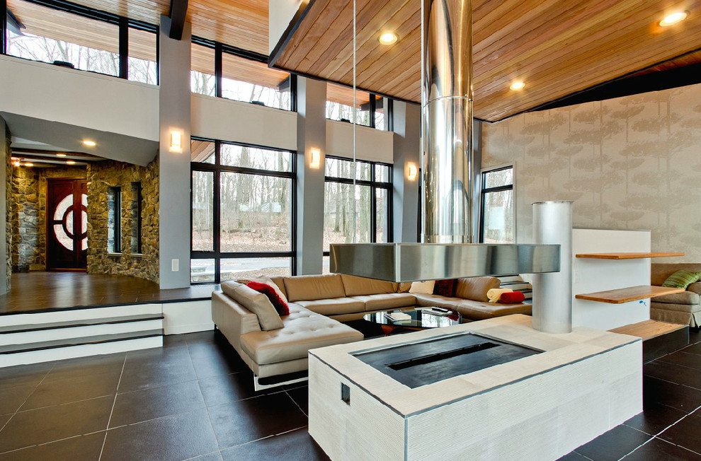 Example of a large minimalist open concept and formal porcelain tile living room design in Philadelphia with gray walls, a hanging fireplace, a metal fireplace and no tv