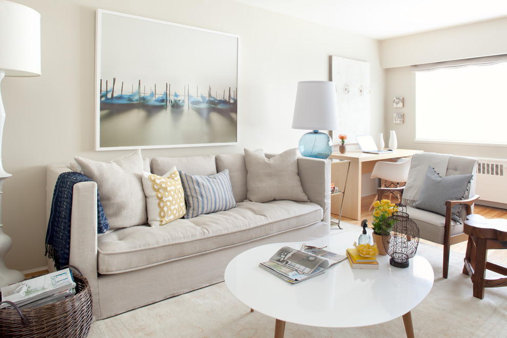 Inspiration for a contemporary medium tone wood floor living room remodel in Vancouver with beige walls