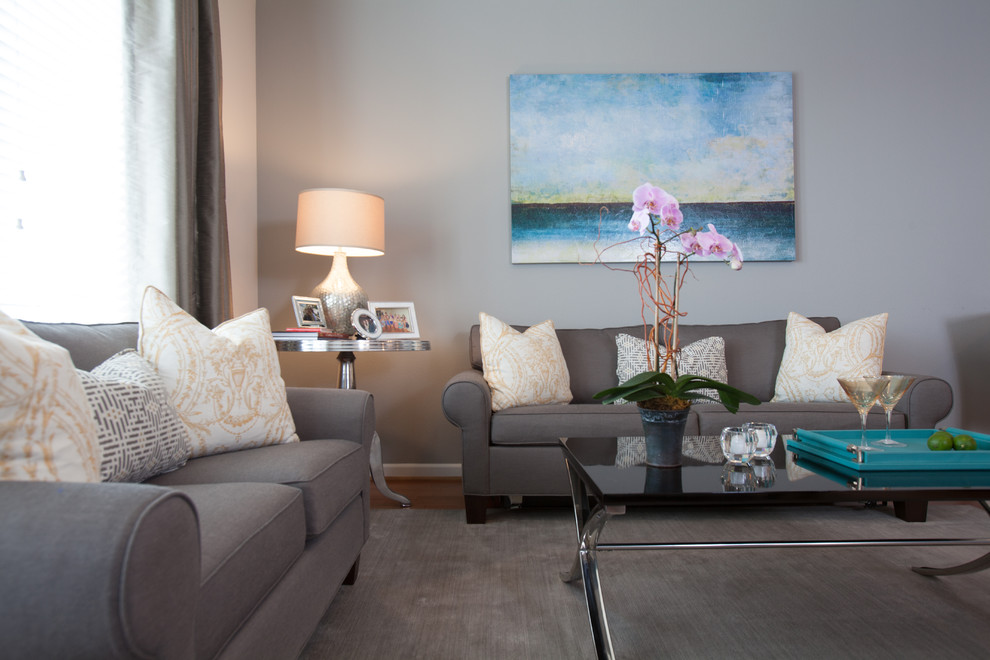 Example of a small minimalist open concept medium tone wood floor living room design in Houston with gray walls