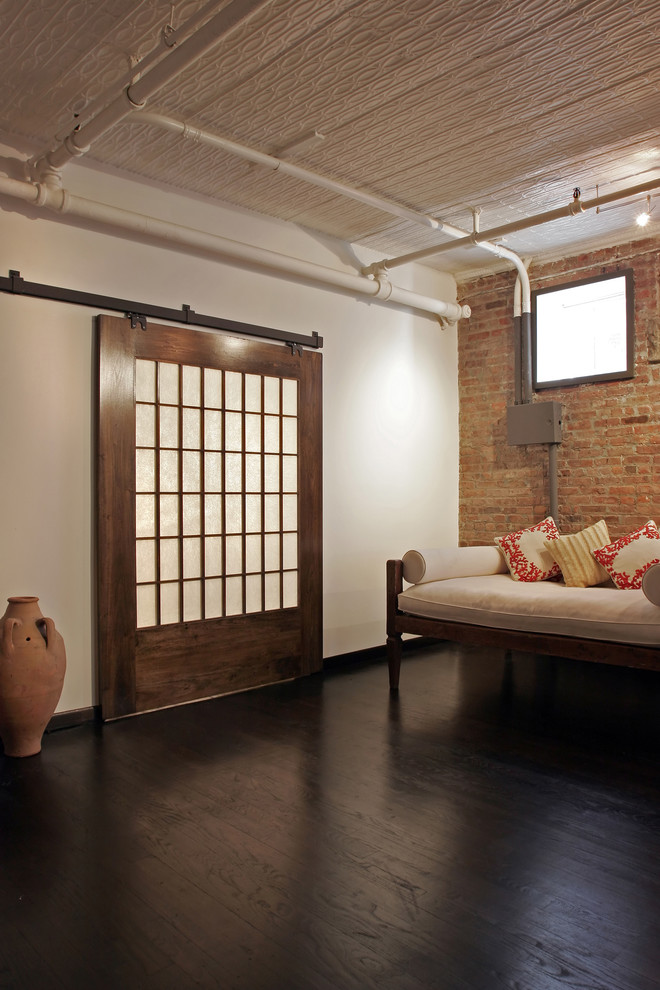Living room - industrial dark wood floor living room idea in New York with white walls