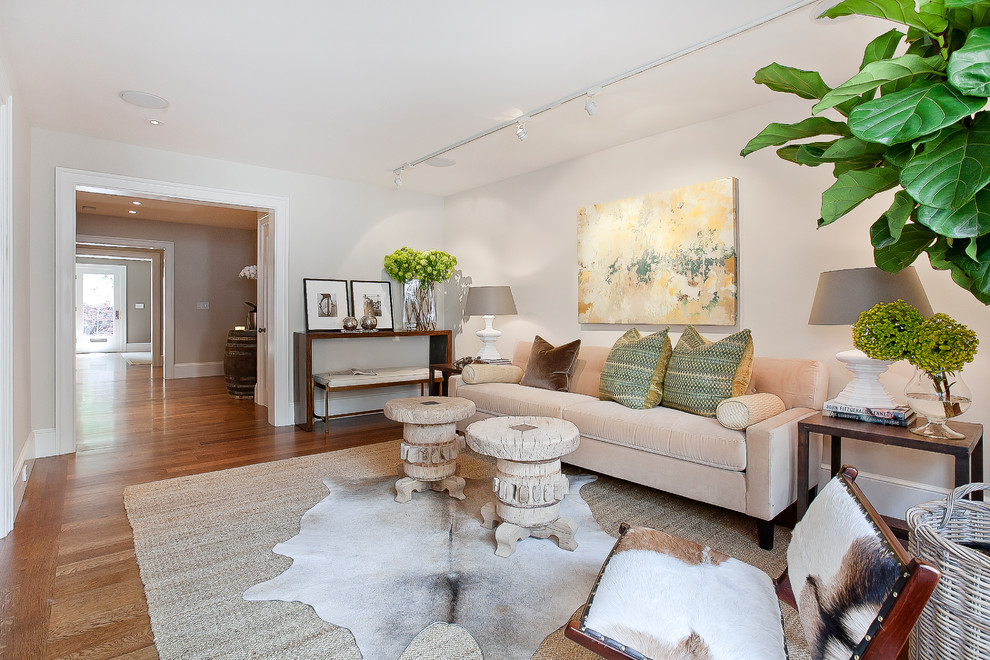 Photo of a traditional grey and cream living room in San Francisco with white walls and medium hardwood flooring.