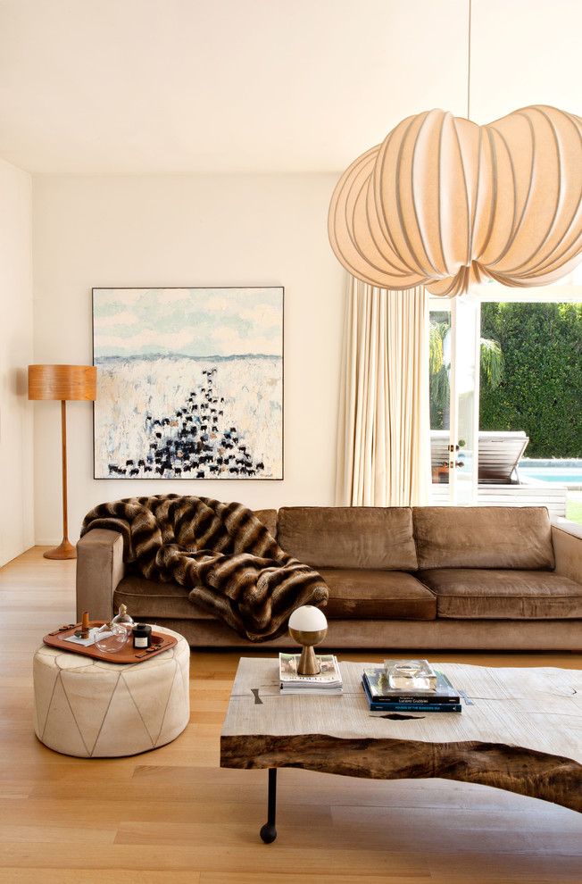 Example of a trendy formal medium tone wood floor and beige floor living room design in Los Angeles with beige walls