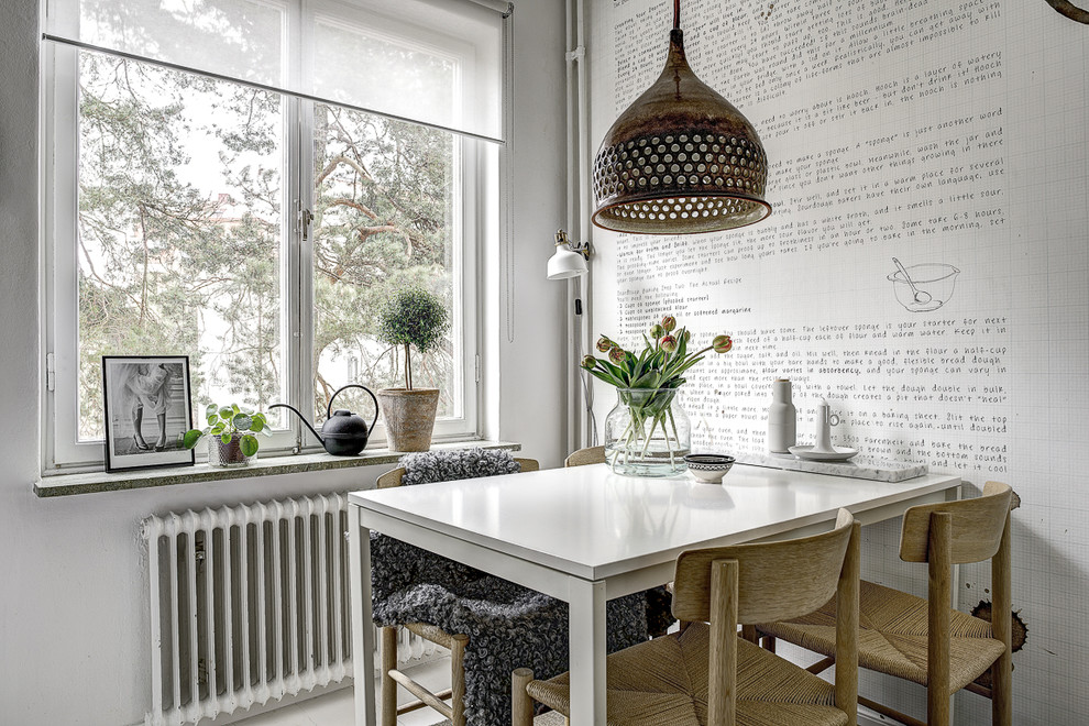 Scandinavian dining room in Stockholm with white walls.