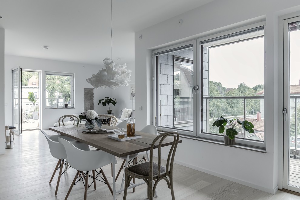 Inspiration for a scandinavian dining room in Stockholm with white walls.