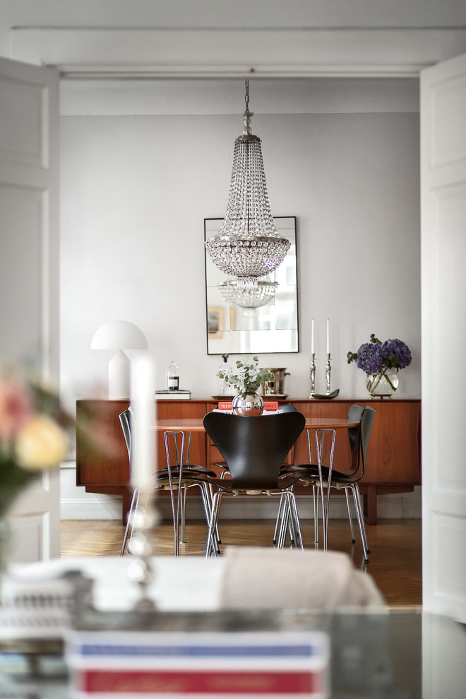 Inspiration for a mid-sized scandinavian medium tone wood floor dining room remodel in Stockholm