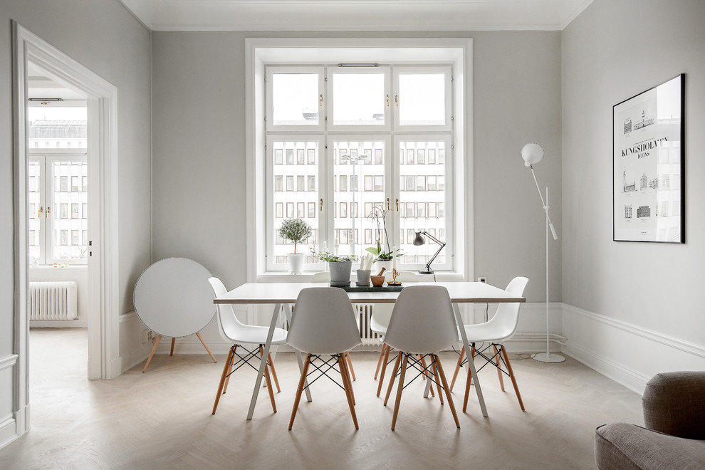 Inspiration for a mid-sized scandinavian light wood floor great room remodel in Stockholm with gray walls and no fireplace