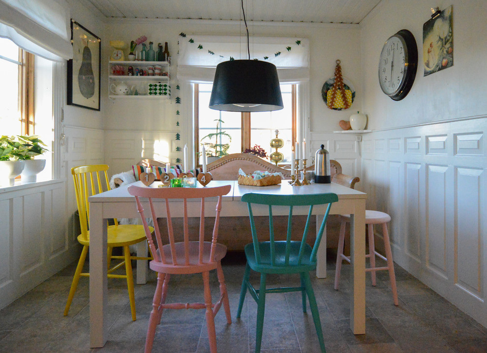 This is an example of a scandi dining room with white walls.