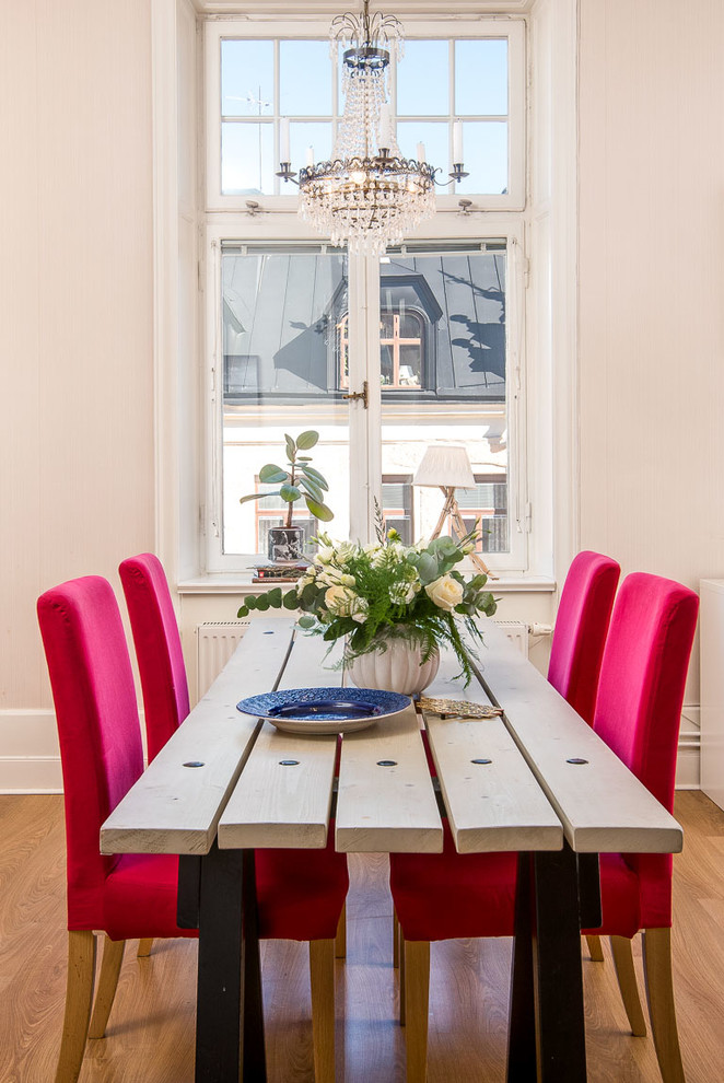 Inspiration for a mid-sized transitional medium tone wood floor enclosed dining room remodel in Other with no fireplace and beige walls
