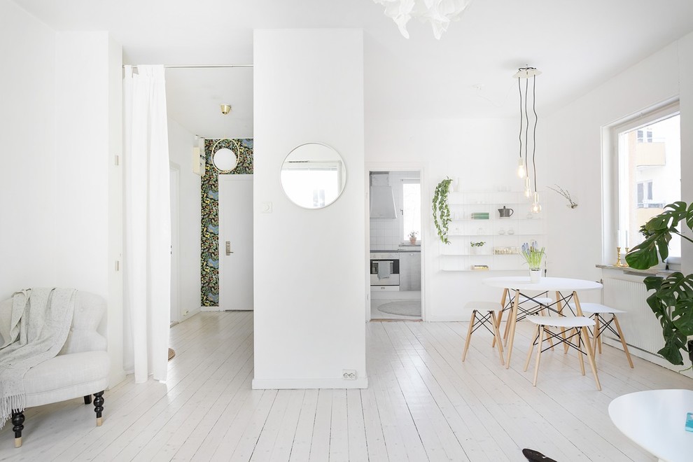 This is an example of a medium sized scandi dining room in Stockholm.