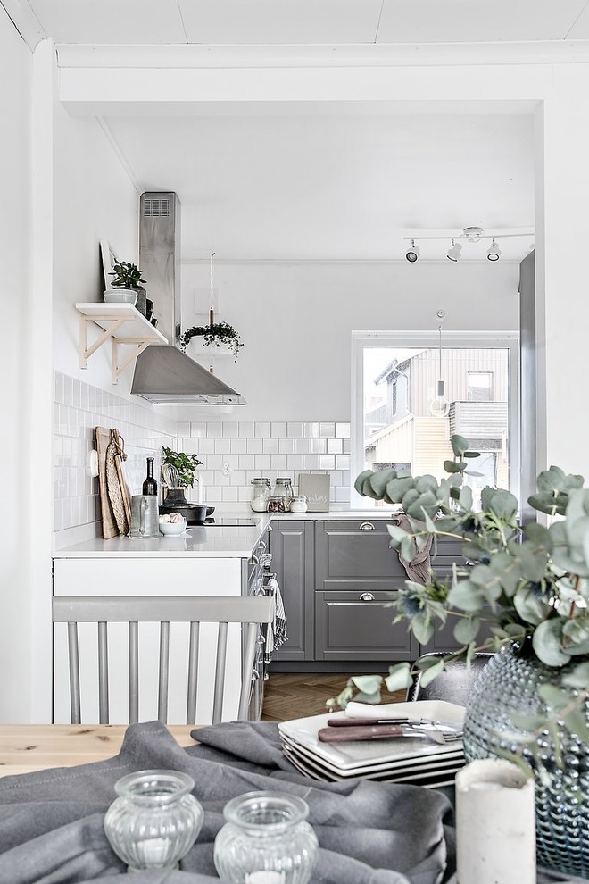 Inspiration for a scandi dining room in Gothenburg with feature lighting.