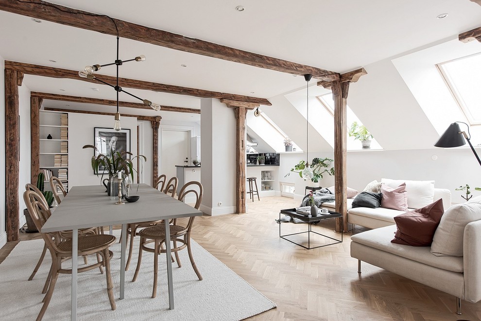 This is an example of a medium sized scandinavian open plan dining room in Gothenburg with white walls, medium hardwood flooring and brown floors.