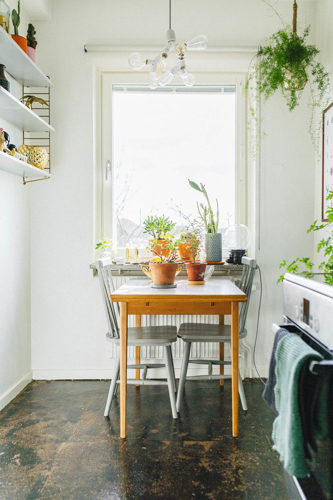 Photo of a small scandinavian kitchen/dining room in Stockholm with white walls and no fireplace.