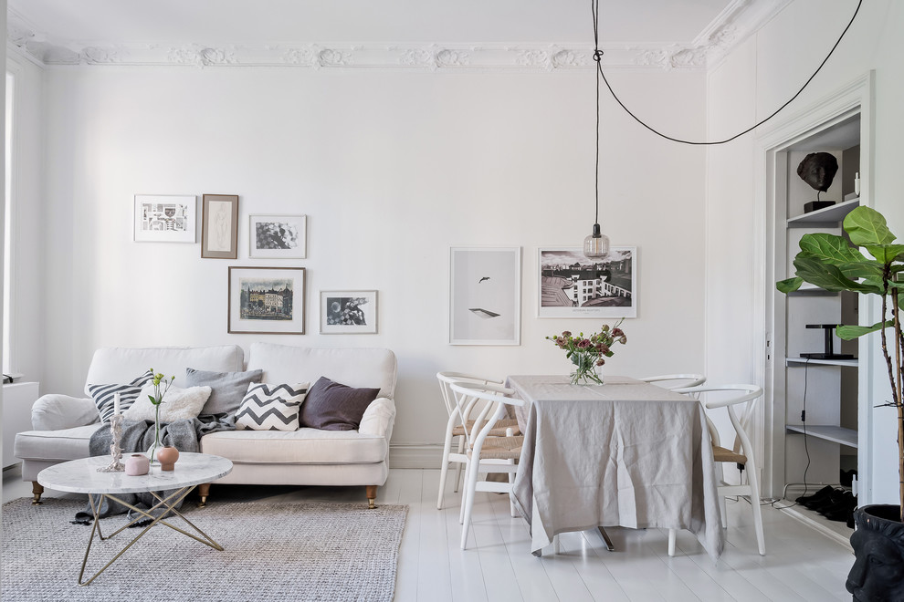 Danish painted wood floor and white floor great room photo in Gothenburg with white walls