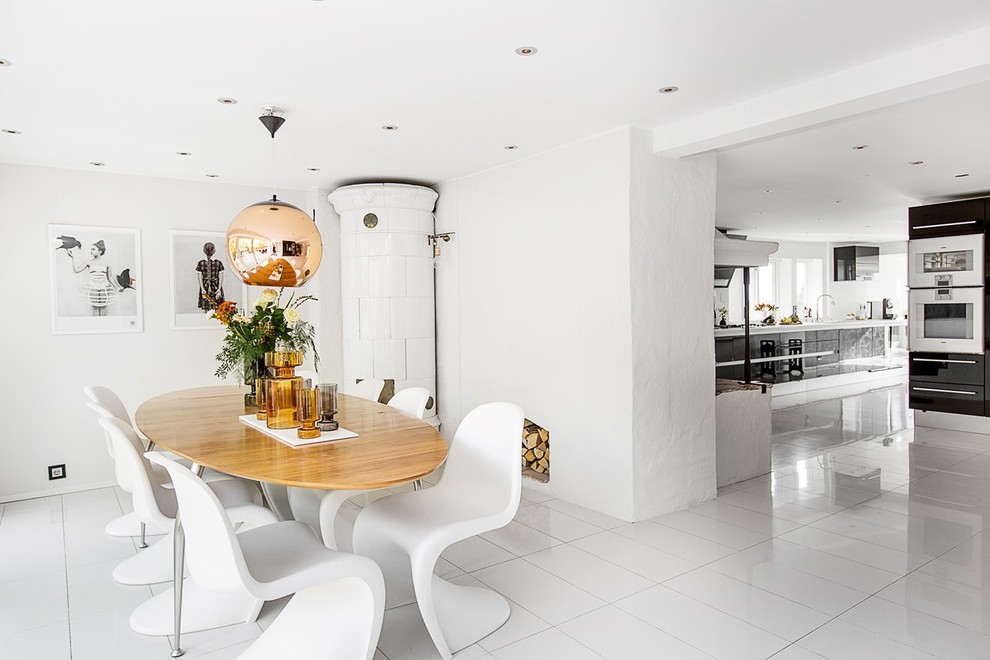 Idée de décoration pour une salle à manger ouverte sur la cuisine design de taille moyenne avec un mur blanc et un sol en carrelage de céramique.