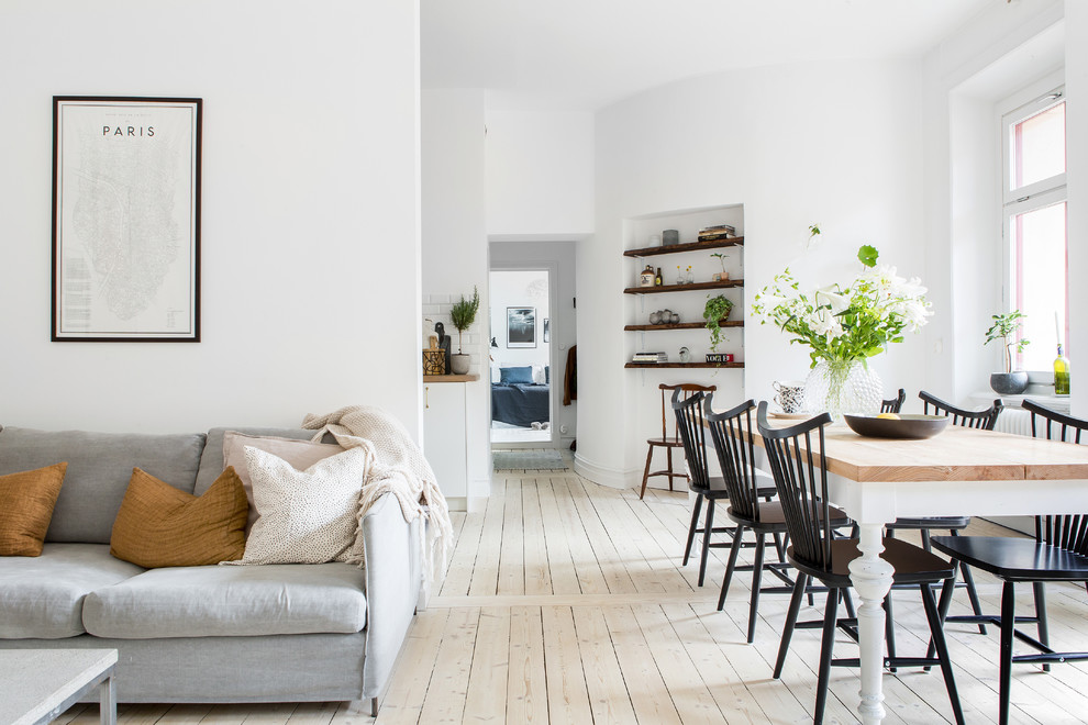 Scandinavian dining room in Gothenburg with white walls.