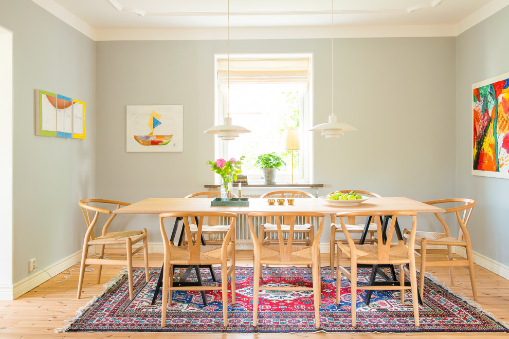 Design ideas for a scandinavian dining room in Other with grey walls, light hardwood flooring and no fireplace.