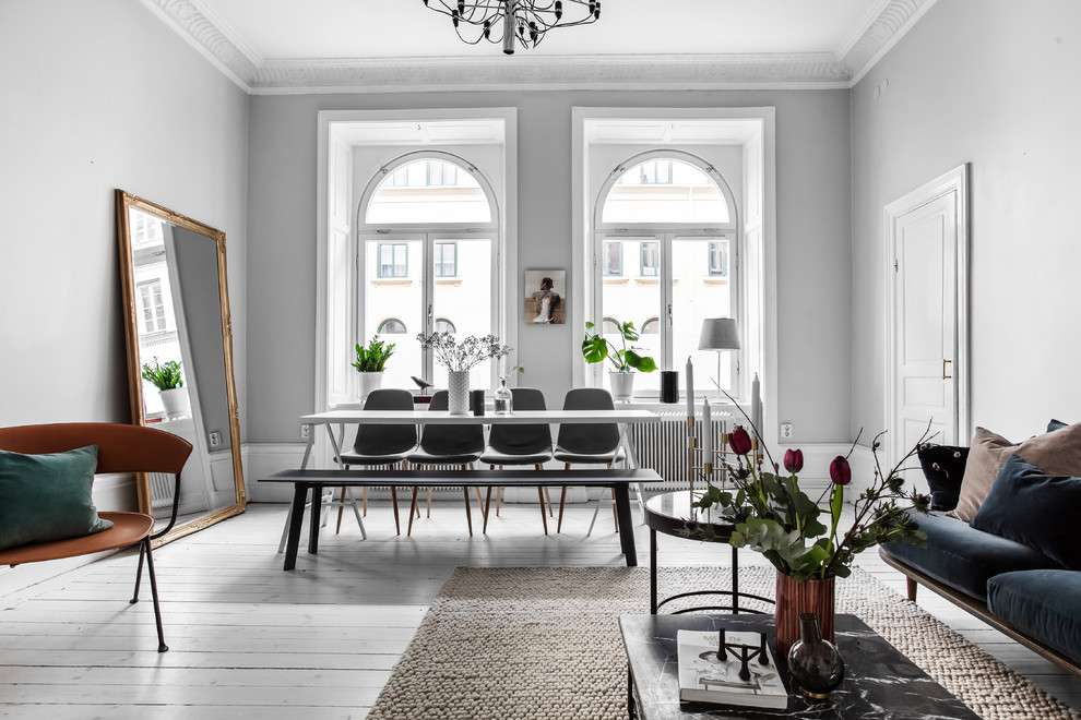 Medium sized scandinavian formal enclosed living room in Stockholm with painted wood flooring, white floors and grey walls.