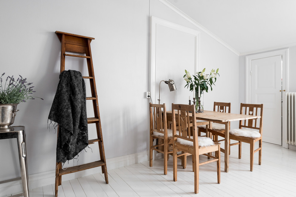 Medium sized scandinavian dining room in Gothenburg with grey walls and painted wood flooring.