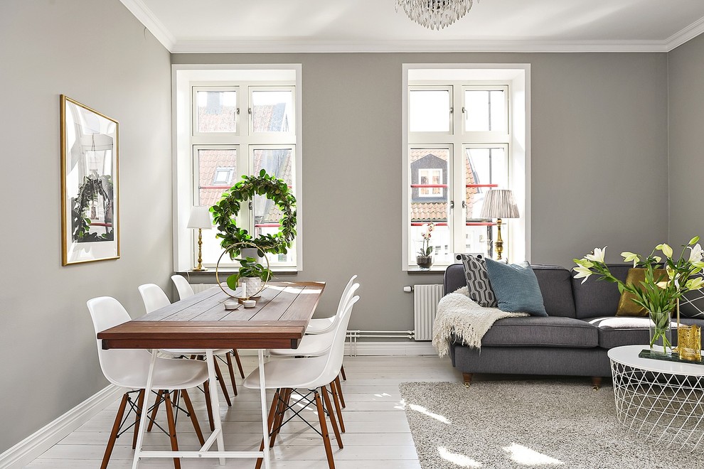 Идея дизайна: гостиная-столовая в скандинавском стиле с серыми стенами, светлым паркетным полом и белым полом
