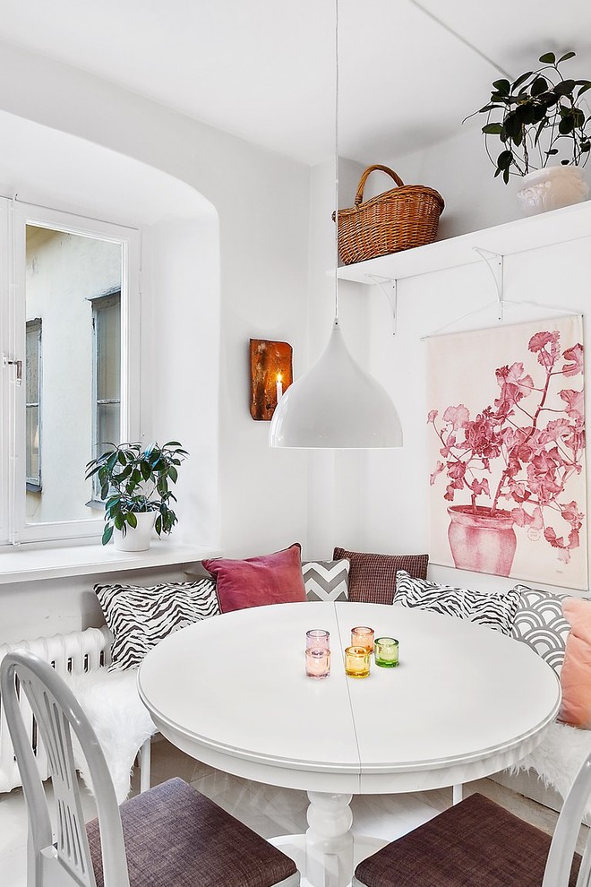 Design ideas for a small scandinavian enclosed dining room in Stockholm with white walls and no fireplace.
