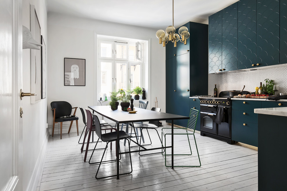 This is an example of a large contemporary kitchen/dining room in Stockholm with white walls and painted wood flooring.