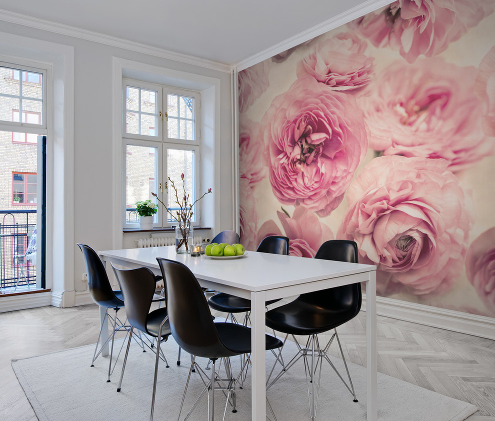 This is an example of a medium sized traditional dining room in Gothenburg with pink walls and light hardwood flooring.