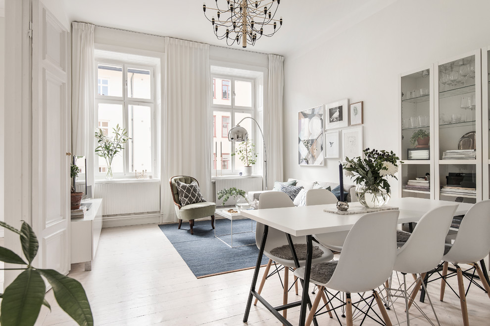 Scandi dining room in Stockholm with white walls.