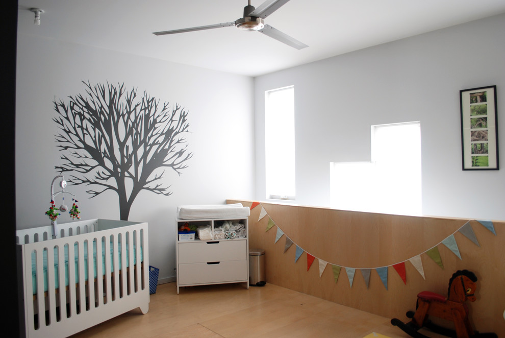 Nursery - modern gender-neutral nursery idea in Philadelphia with white walls