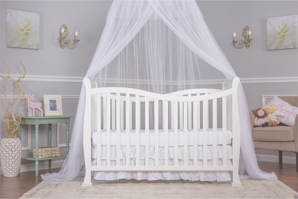 Photo of a classic nursery for girls in New York with grey walls and a dado rail.