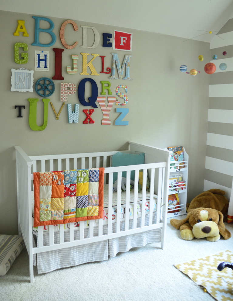 Example of a transitional gender-neutral carpeted nursery design in Austin with beige walls