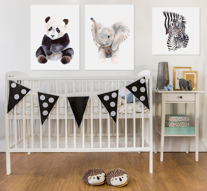 Photo of a classic gender neutral nursery in San Diego with white walls and medium hardwood flooring.