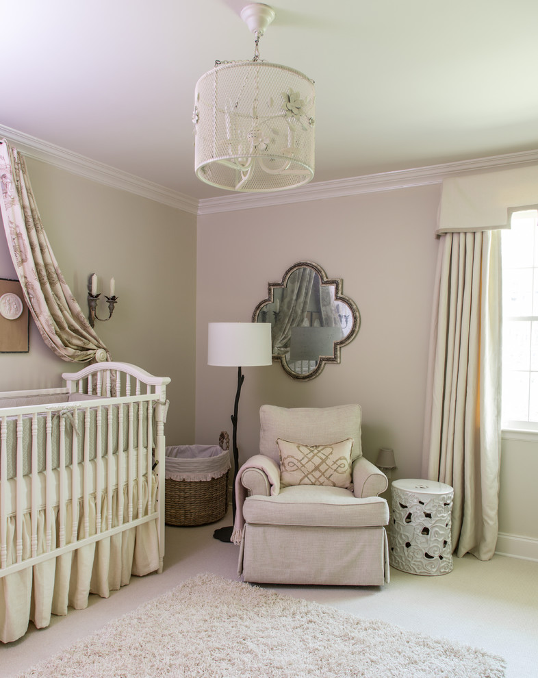 Classic nursery for girls in New Orleans with beige walls, carpet and beige floors.