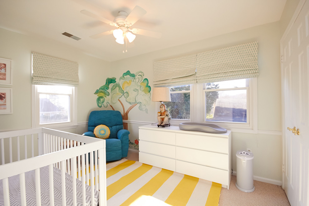 Design ideas for a beach style nursery for girls in Other with green walls.