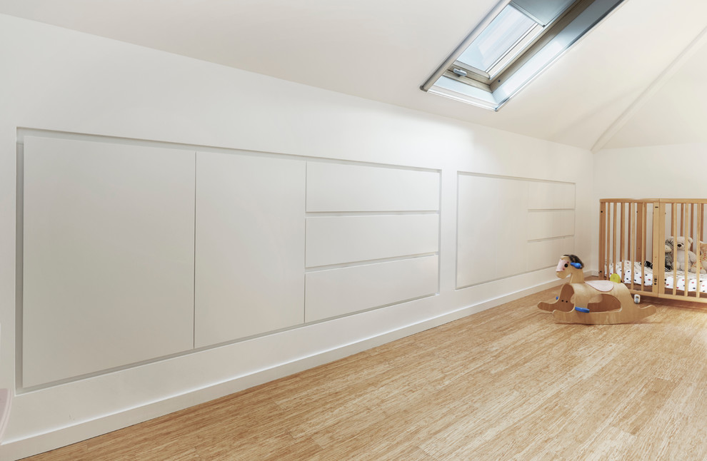 Medium sized contemporary gender neutral nursery in Sydney with white walls and light hardwood flooring.