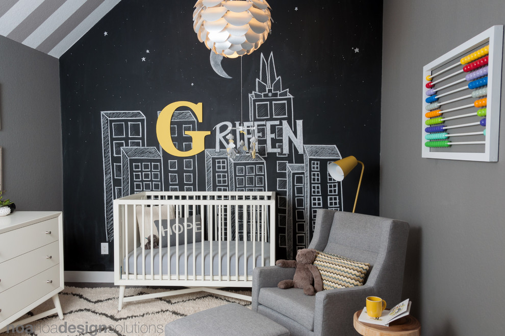 Small modern nursery for boys in Austin with grey walls and dark hardwood flooring.