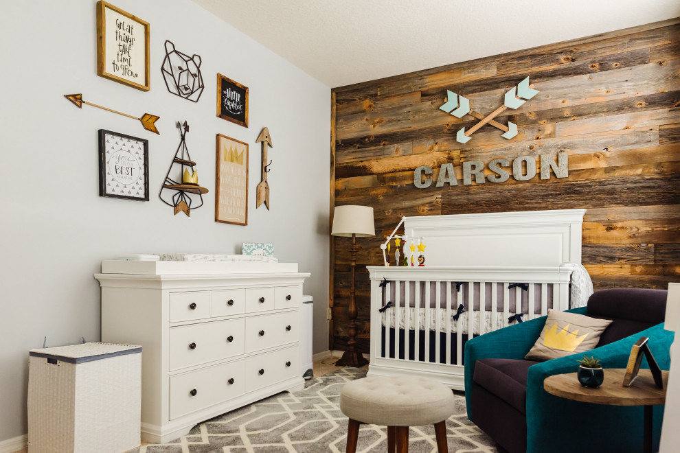 Photo of a farmhouse nursery in Tampa with grey walls, wood walls and a feature wall.