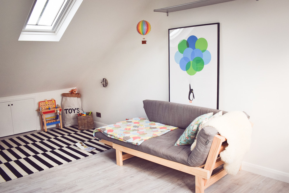 Design ideas for a medium sized contemporary gender neutral nursery in Essex with white walls and vinyl flooring.