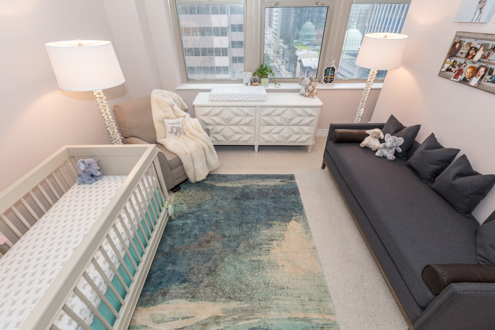 Medium sized contemporary nursery for boys in Philadelphia with beige walls, carpet and beige floors.